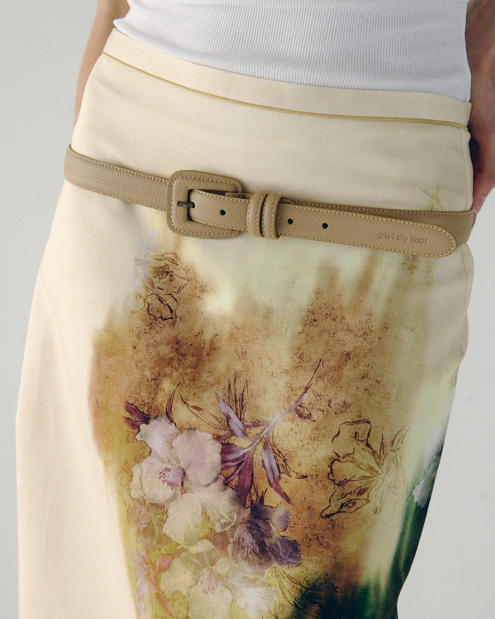 woman wearing beige leather belt